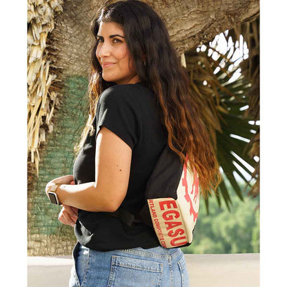 women wearing recycled sling backpack - pegasus