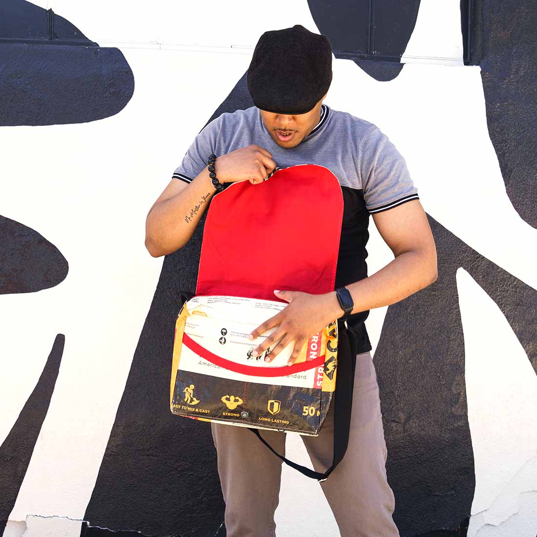 cool guy with cool camel print messenger bag