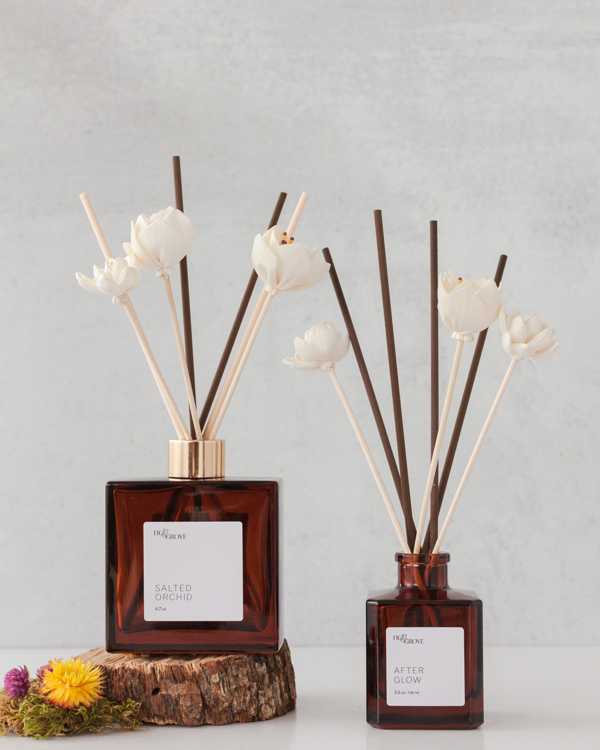 Fig &amp; Grove reed diffuser styled with flower reeds for a bathroom, bedroom, or entryway