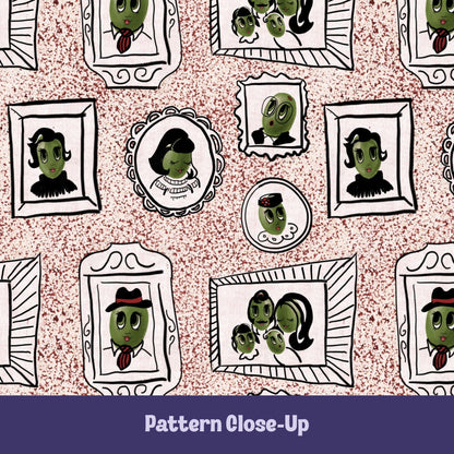 Close-up of retro olive portrait pattern on dusty rose tea towel showing hand-illustrated olive characters in ornate frames on terrazzo speckled background