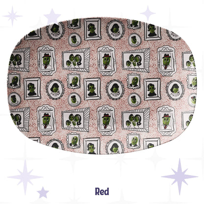 Retro olive portrait serving platter in red speckle colorway showing full allover mid-century gallery wall pattern of framed illustrated olive characters on warm blush crimson-speckle ground