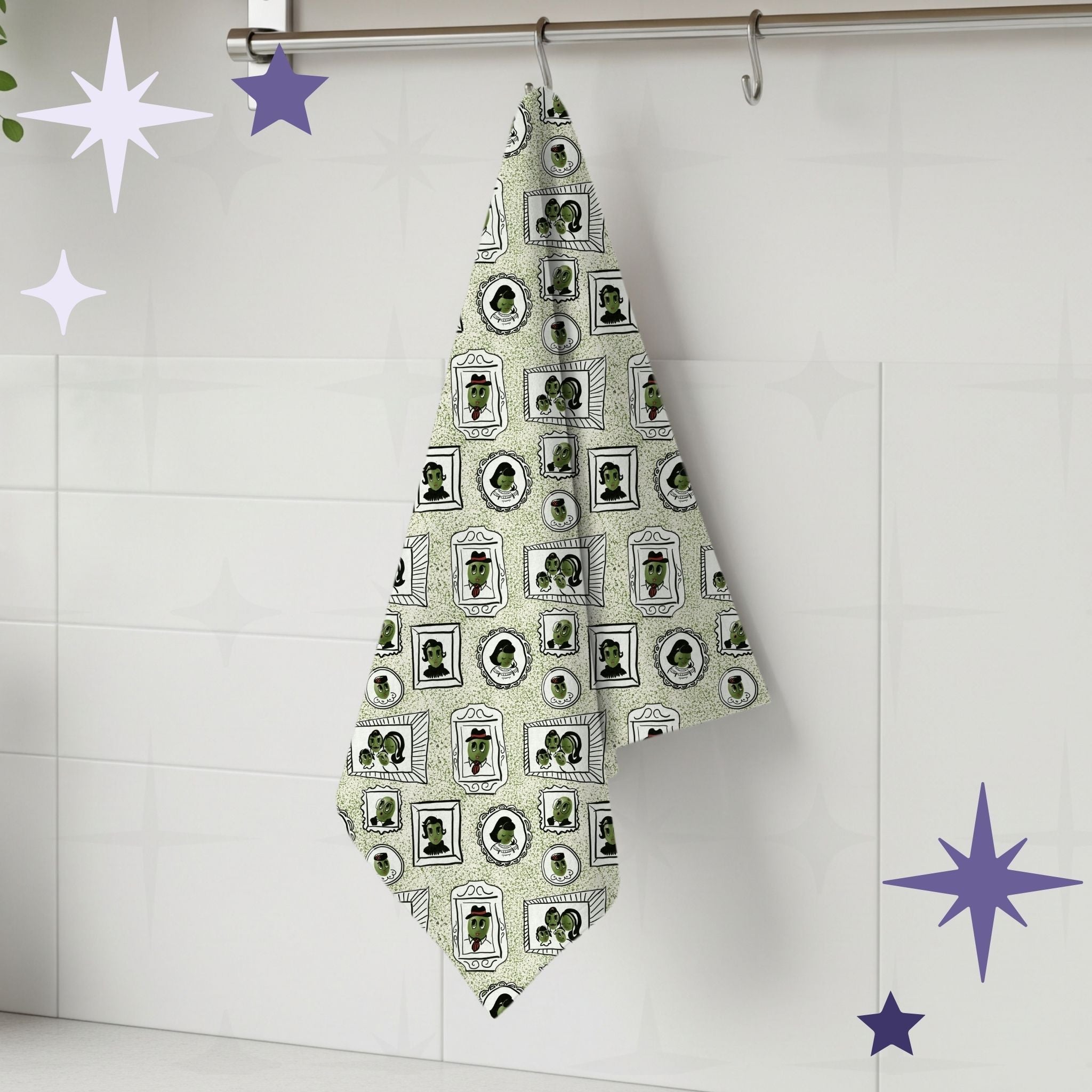 Sage green retro olive portrait tea towel hanging from silver kitchen hook against white tile backsplash