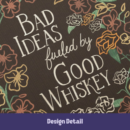 Close-up detail of vintage typography reading Bad Ideas Fueled by Good Whiskey on dark maximalist wildflower pattern hardcover journal