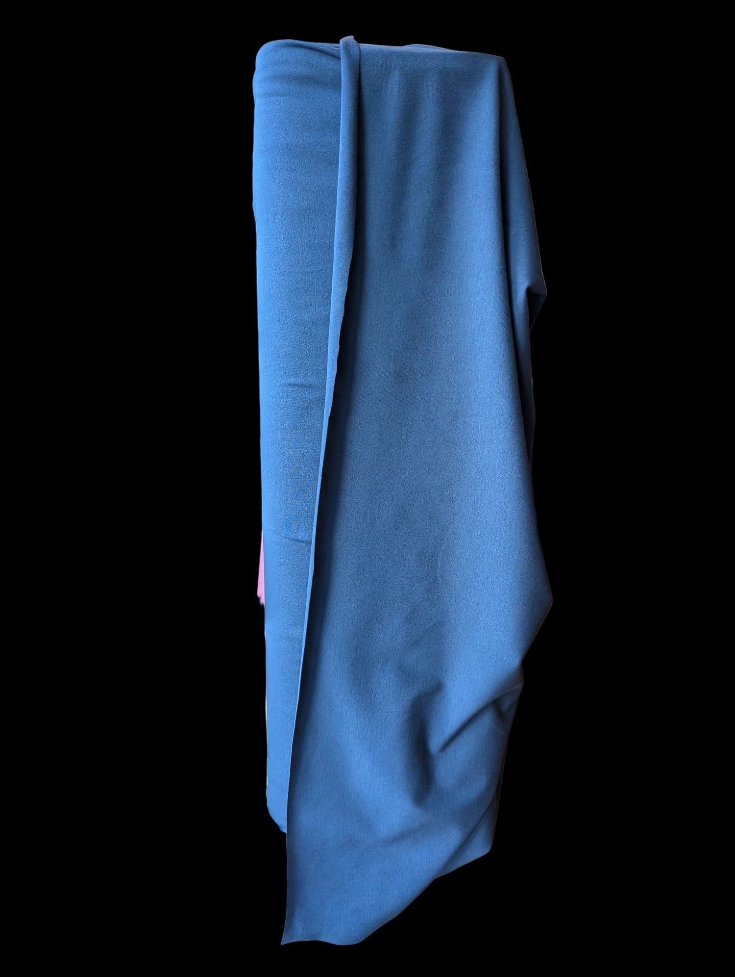 Navy blue cotton spandex fabric draped over the bolt