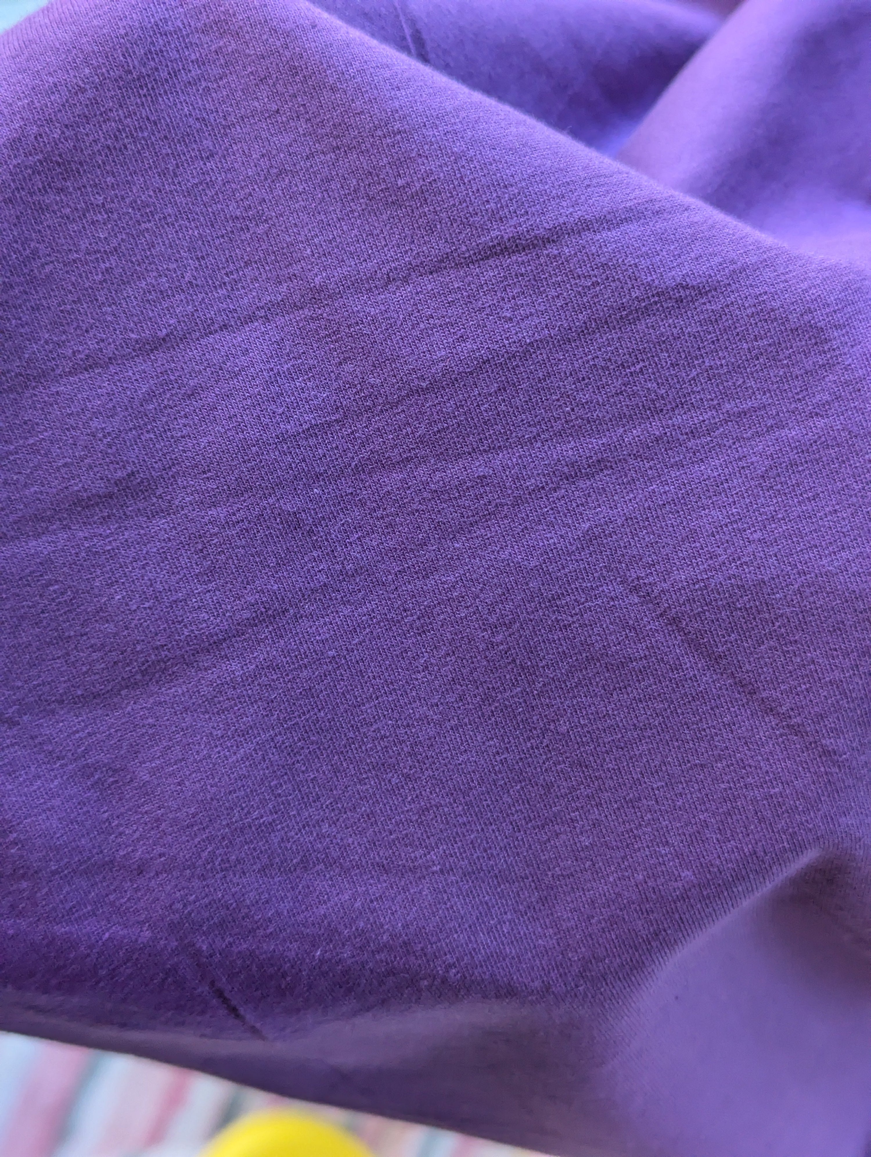 Close up of grape cotton spandex fabric