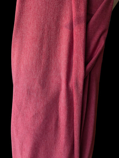 Vintage T-shirt weight cotton spandex in a red tomato color, draped off the bolt
