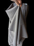 Gray Cotton linen blend held up to show structured drape.