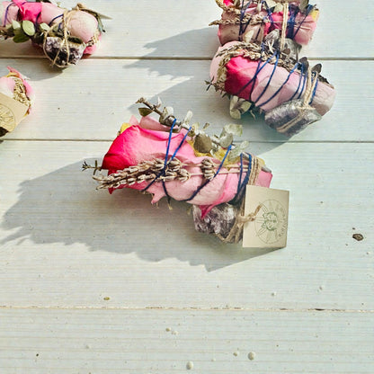 sage with rose petals lavender and amethyst crystals