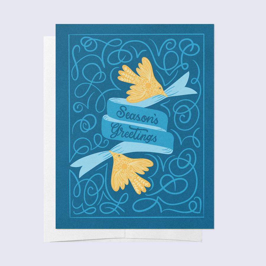 A folded greeting card with a blue background featuring yellow birds and the text &