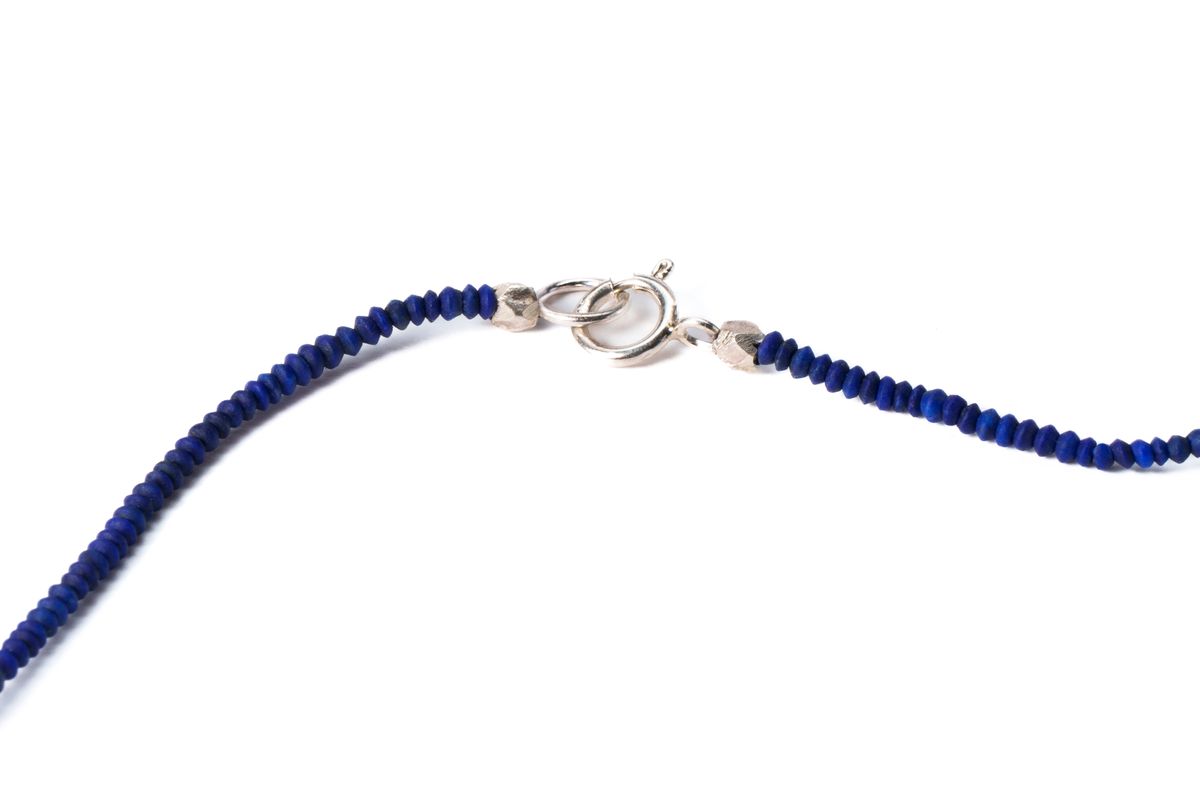 Blue lapis lazuli hand beaded necklace showing sterling silver clasp, close up