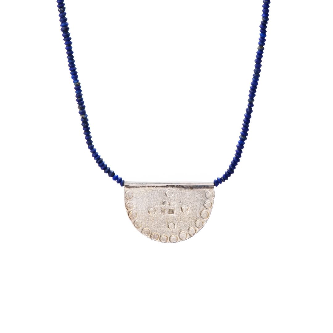 Ethically made in mexico, blue lapis lazuli beads with a Silver textured half-circle pendant, chicago jewelry store