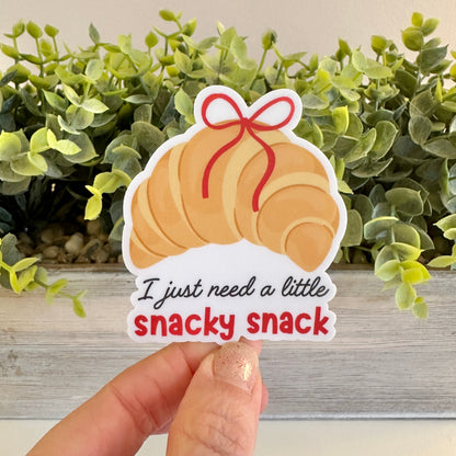 Sticker of a croissant with text &