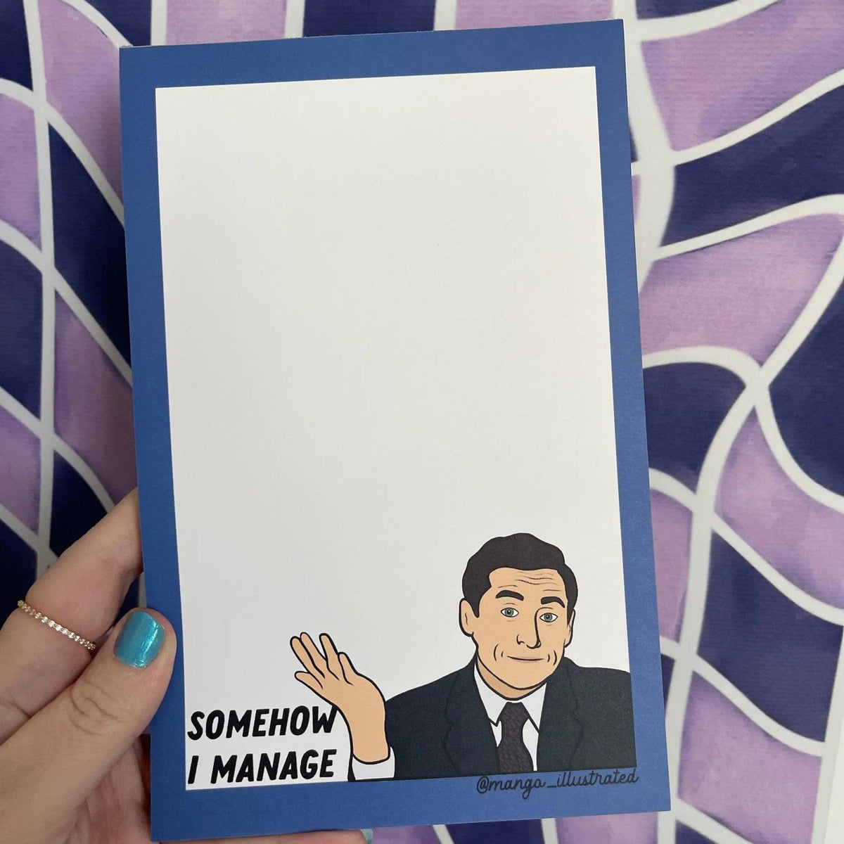 Somehow I Manage notepad detail — hand drawn shrugging boss illustration with green eyes by indie artist MangoIllustrated
