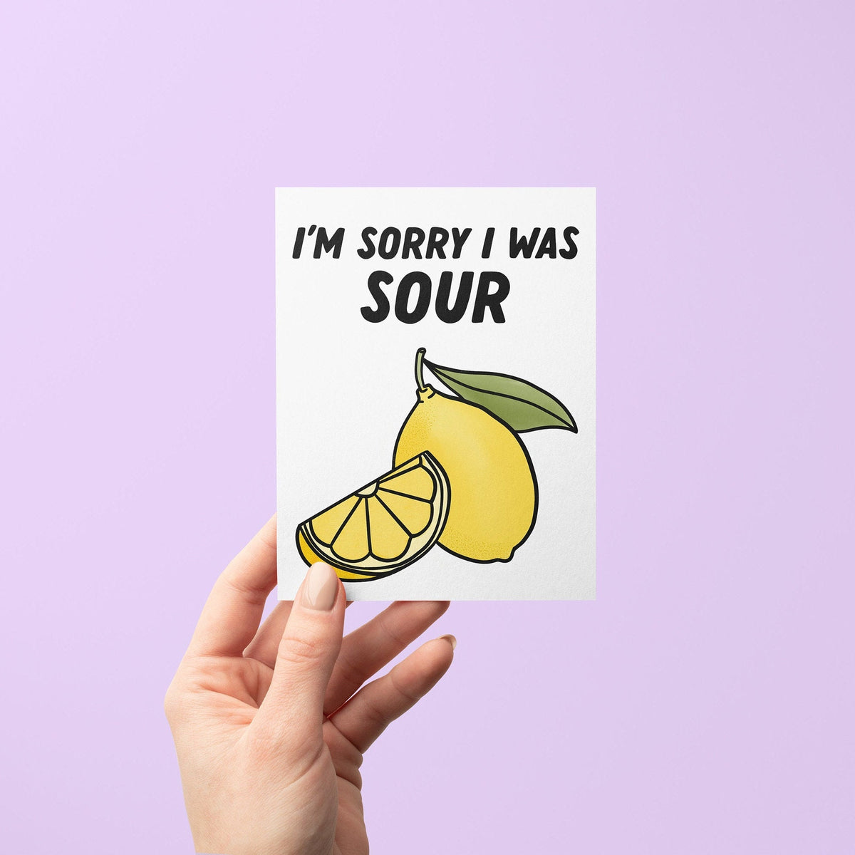 Sorry I was sour apology card flat lay — cheeky illustrated lemon apology card by indie artist MangoIllustrated