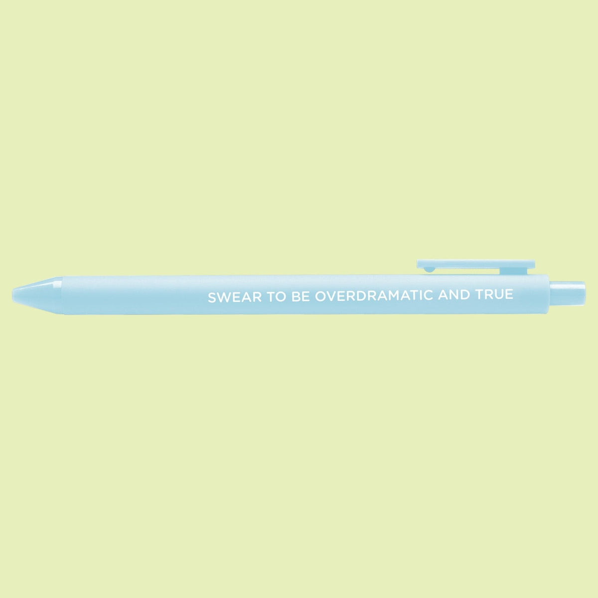 Swear to be overdramatic and true pen styled on a desk — powder blue jotter pen by indie artist MangoIllustrated
