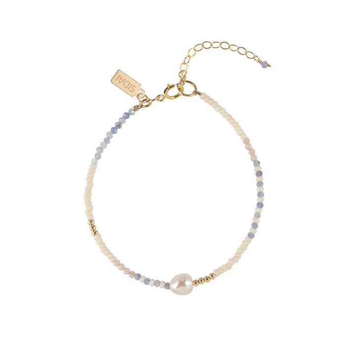 Handmade tanzanite pearl bracelet, ethical artisan gift — Petite Protea Chicago