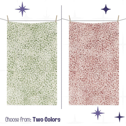 Two terrazzo print tea towels hanging on closeline  showing terracotta red and sage green colorways side by side with mid century modern starburst graphic elements