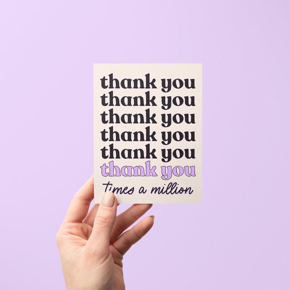 Thank You times a million card flat lay — purple gratitude card styled on a desk, by indie artist MangoIllustrated