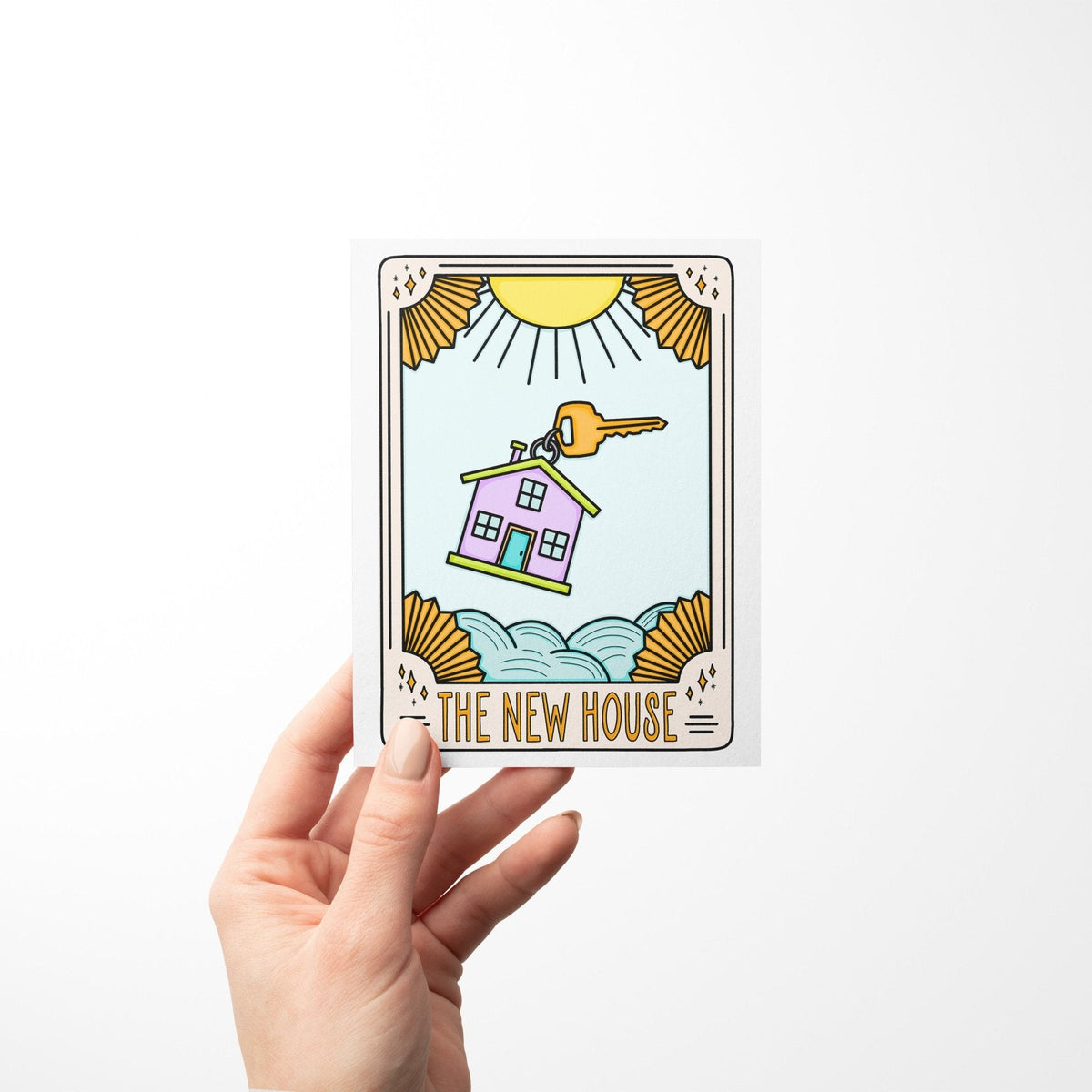The New House Tarot Card Congratulations Card detail — close up of the golden key and celestial cloud artwork by indie artist MangoIllustrated