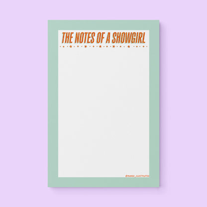Notepad with mint green border and bold orange text “The Notes of a Showgirl” with star accents – glam stationery pad for lists and journaling.
