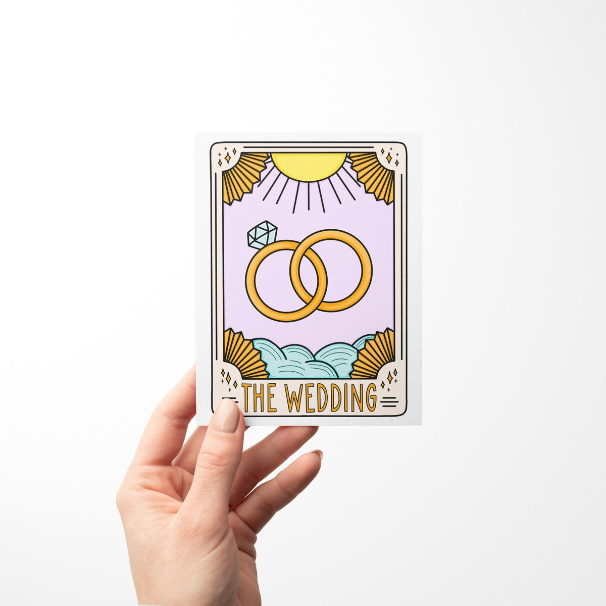 The Wedding Tarot Card Congratulations Card detail — close up of the gold ring and pastel sunburst illustration by indie artist MangoIllustrated