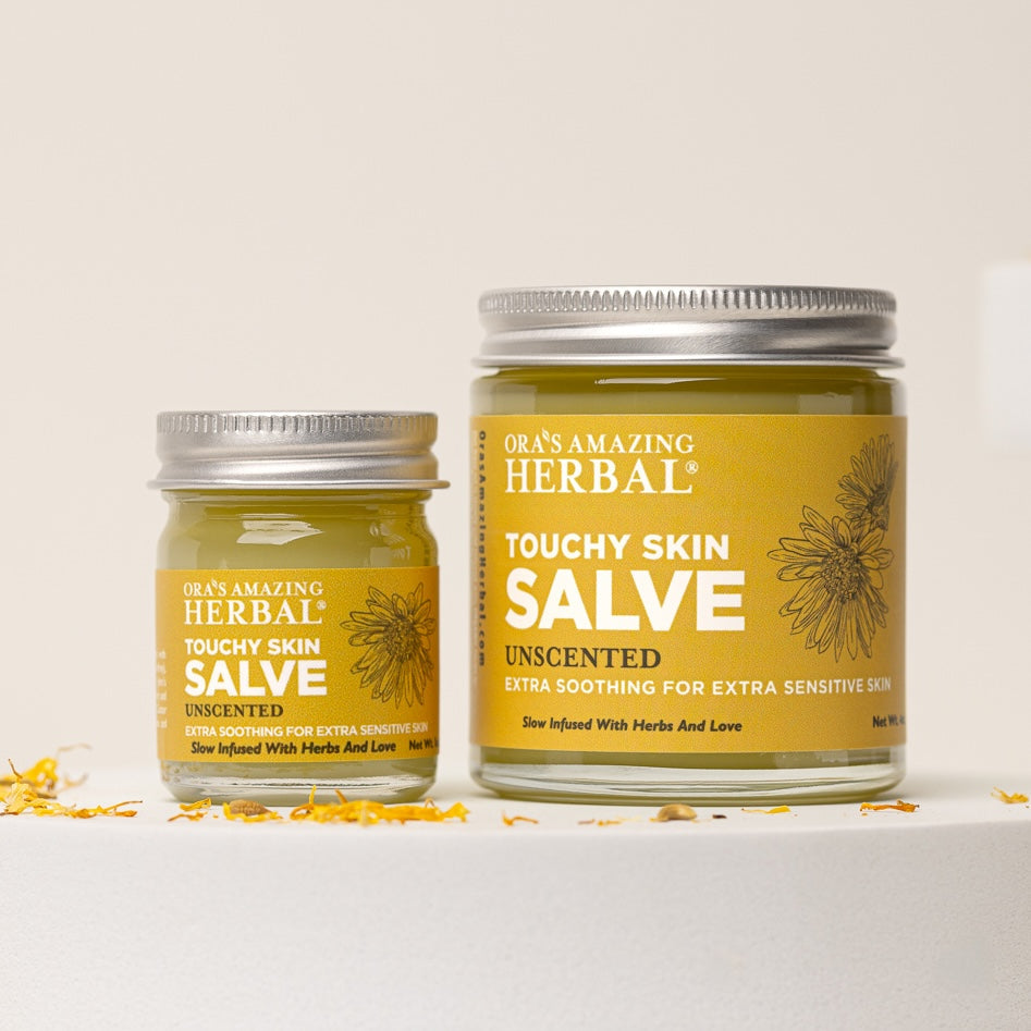 Touchy Skin Salve 4oz and 1oz Set Lifestyle Indoor Calendula Flowers