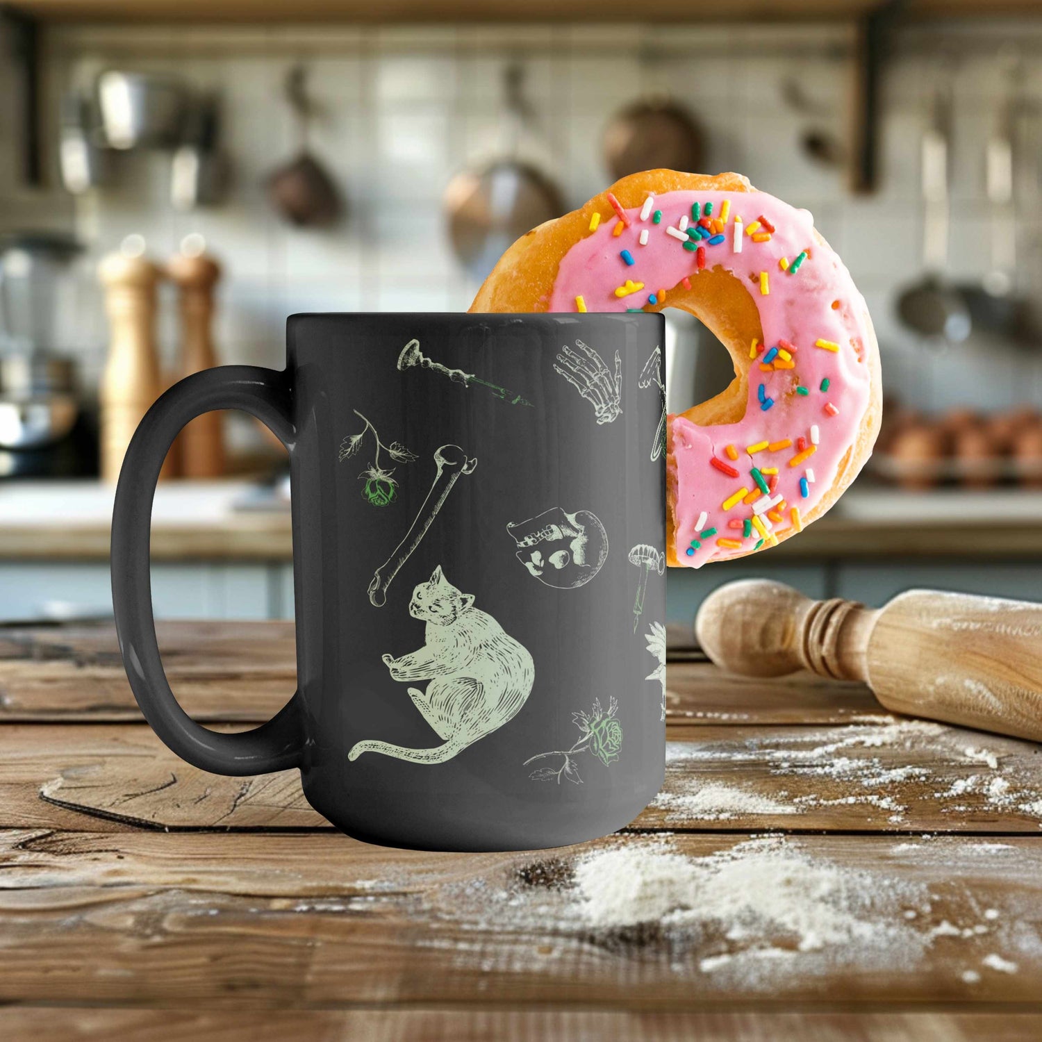 Arsenic green zombie icons mug on a floured wooden counter beside a pink frosted donut with sprinkles