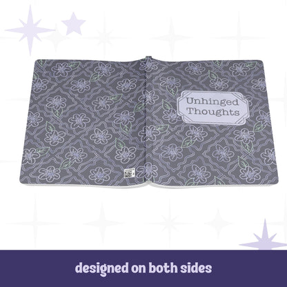 Unhinged Thoughts journal open flat showing full wrap design on front and back covers with dark floral botanical pattern