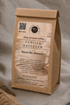 A kraft paper coffee bag labeled &