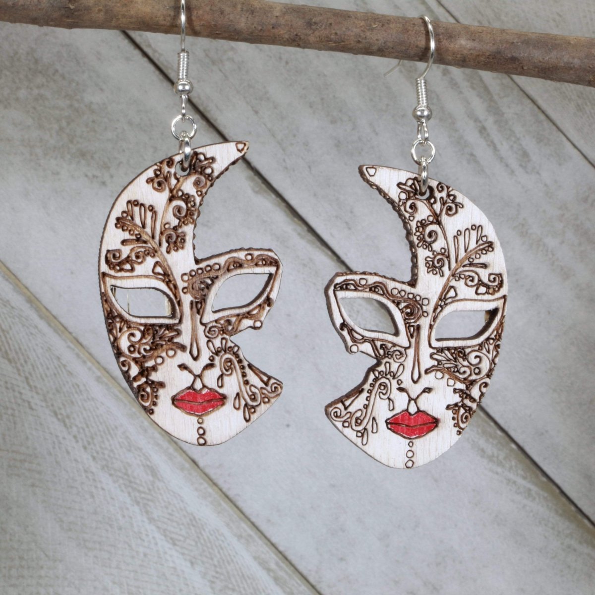 Hand-painted wooden Venetian half mask dangle earrings featuring an elegant masquerade design with decorative curves and intricate detailing and hypoallergenic sterling silver hooks, lightweight jewelry for costume events and masquerade enthusiasts by Cate’s Concepts