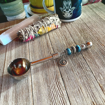 Astro Bowl Spoon featuring enchanting zodiac charm and focus stone handle, perfect for tea lovers.