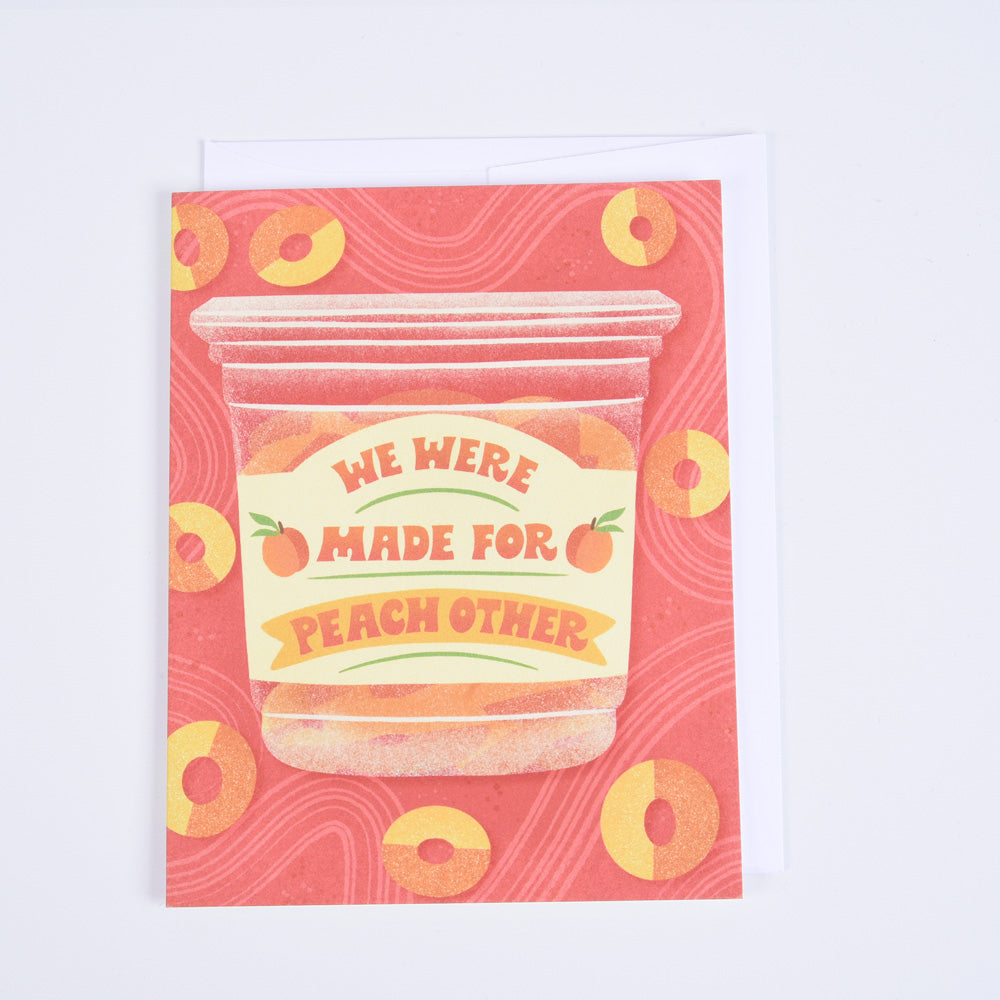 A folded greeting card with an illustration of a plastic container of peach gummy candies and message &