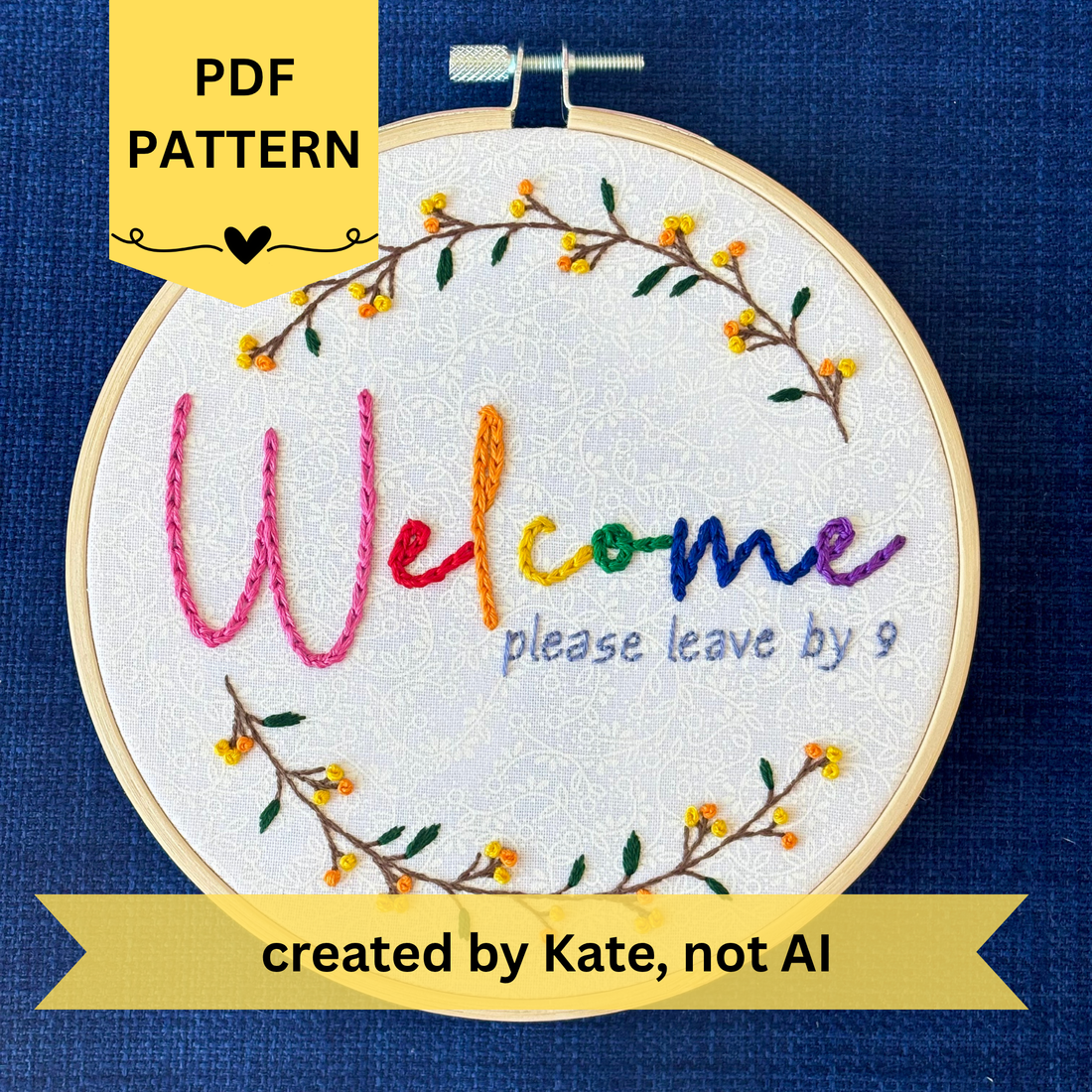 PDF pattern created by Kate, not AI. "Welcome, please leave by 9". Welcome hand embroidered in rainbow colors from pink to purple. Please leave by 9 hand embroidered in a light blue gray. A floral wreath of flower stems with yellow and orange buds create the impression of a circle. Fabric is white-on-white cotton. Framed in a light wooden embroidery hoop and displayed as wall art.