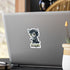 Small chibi werewolf sticker with green eyes and TURNT lettering on the back of a silver laptop