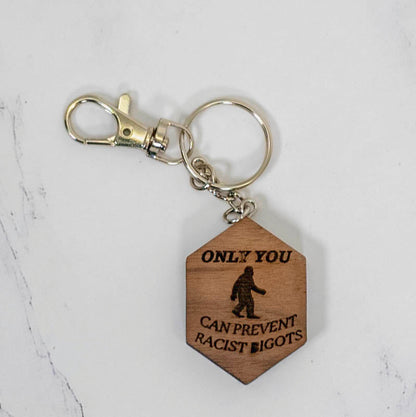 Walnut hexagon wood keychain engraved with a full Bigfoot silhouette and the words Only You Can Prevent Racist Bigots, silver clasp, by PRWMade