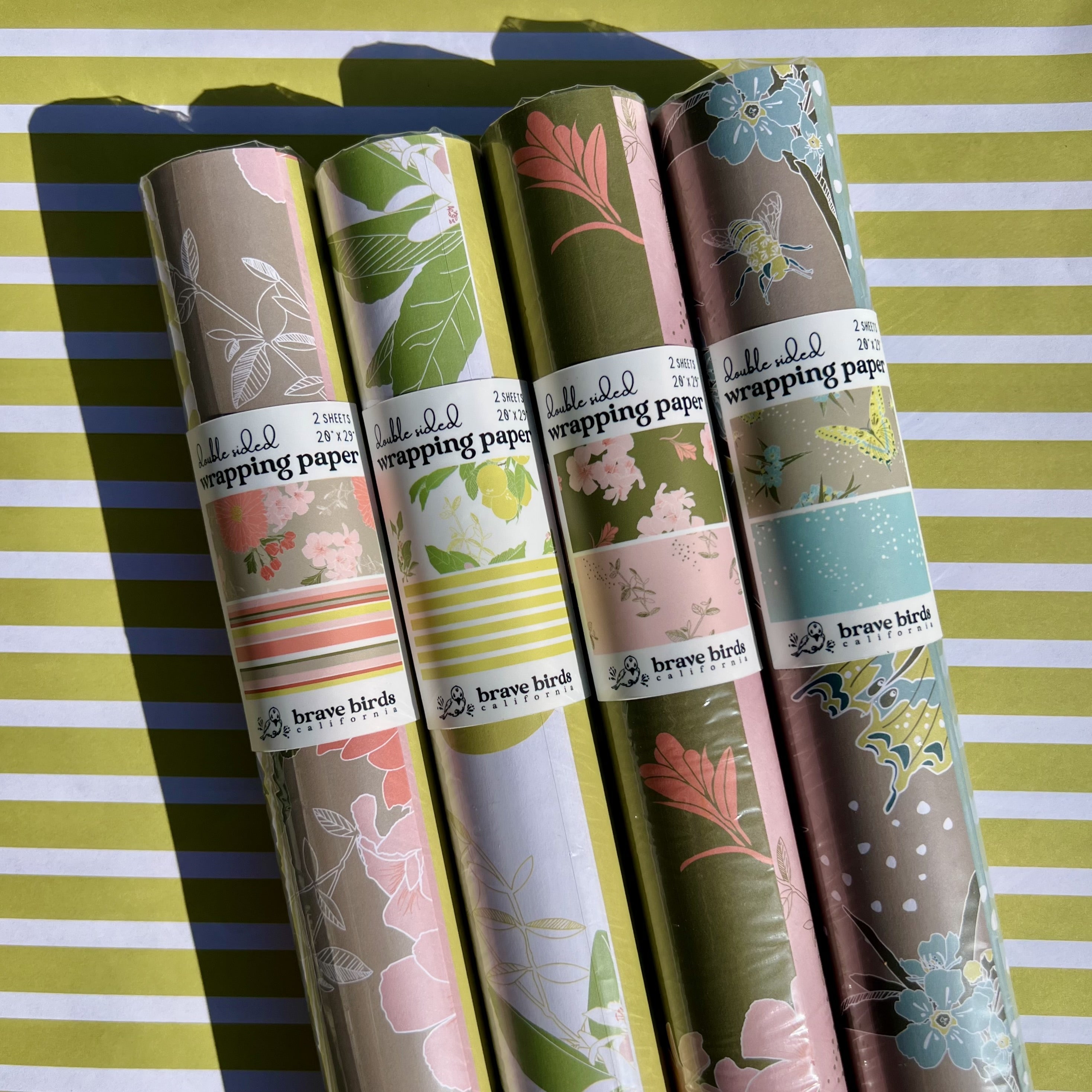 Packaged rolls of all 4 pattern options in double sided wrapping paper