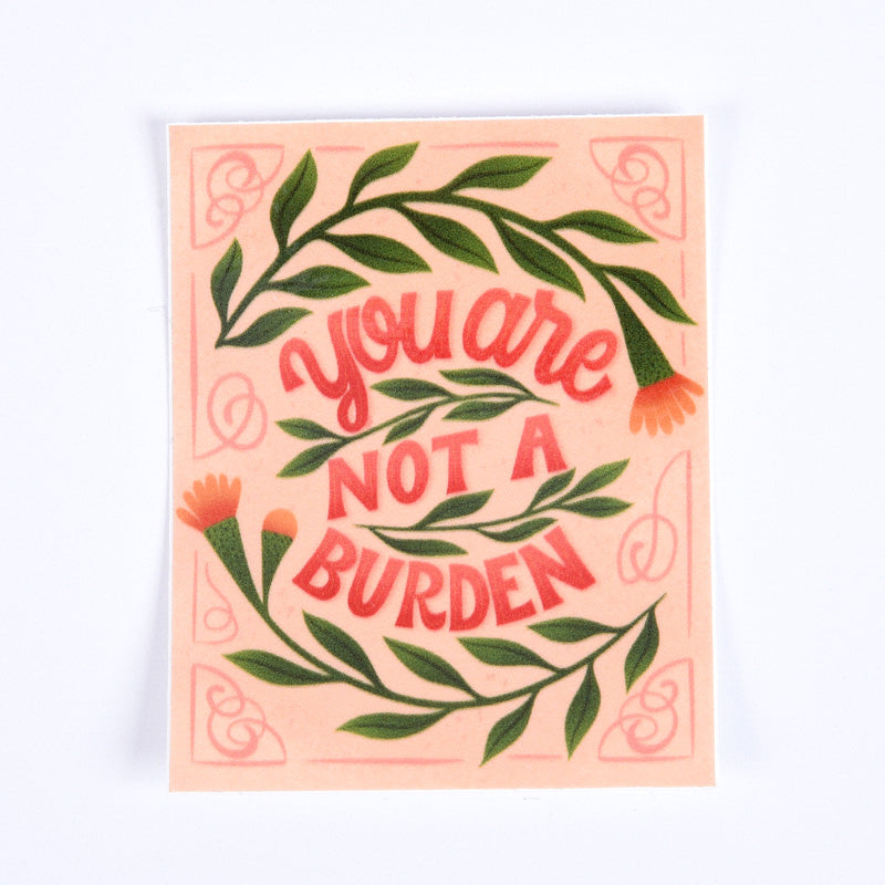 A sticker with a floral pattern and the text &
