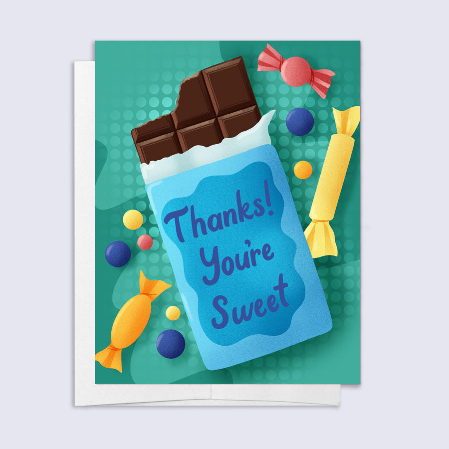 Greeting card with a candy bar and colorful candies on a green background "thanks! you&
